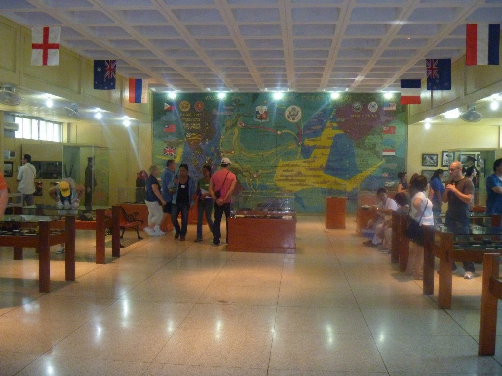 The museum interior with mural in background