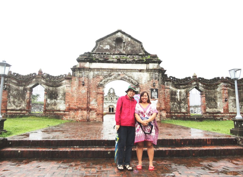 The scrollwork-decorated octagonal red brick walls and 18 ft. high arch